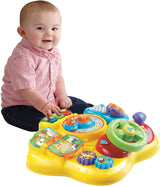 VTech Baby Adventure Play Table - Mesa de juego colorida para bebés con 6 campos de juego y elementos interactivos & Baby My First Song Book Libro colorido de 6 páginas y elementos móviles para jugar Bebe Toys Naty Shop