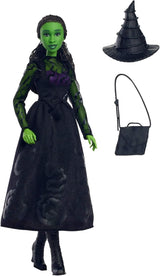 Mattel Muñeca de moda Wicked Elphaba y accesorios con piel verde, cabello trenzado negro, varias poses posibles y apariencia de vestido de fiesta extensible, HXT62, [Multicolor] Naty Shop Dolls