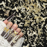 50Stück 3D Lazo Dorado Nail Charms Mariposa Nail Art Charms Legierung Bogen Nagel Charms Nägel Zubehör Schleife Nagelschmuck Metall Schleifen Schmetterling Nageldesign Nagelanhänger Nailart Strasssteine