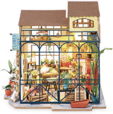Robotime DG145 Rolife Emily's Flower Shop Casa de Muñecas en Miniatura Fabricada en madera, metal, tela y cartón, Dimensiones: 22 X 15 X 17 Cm, Naty Shop casas de muñecas