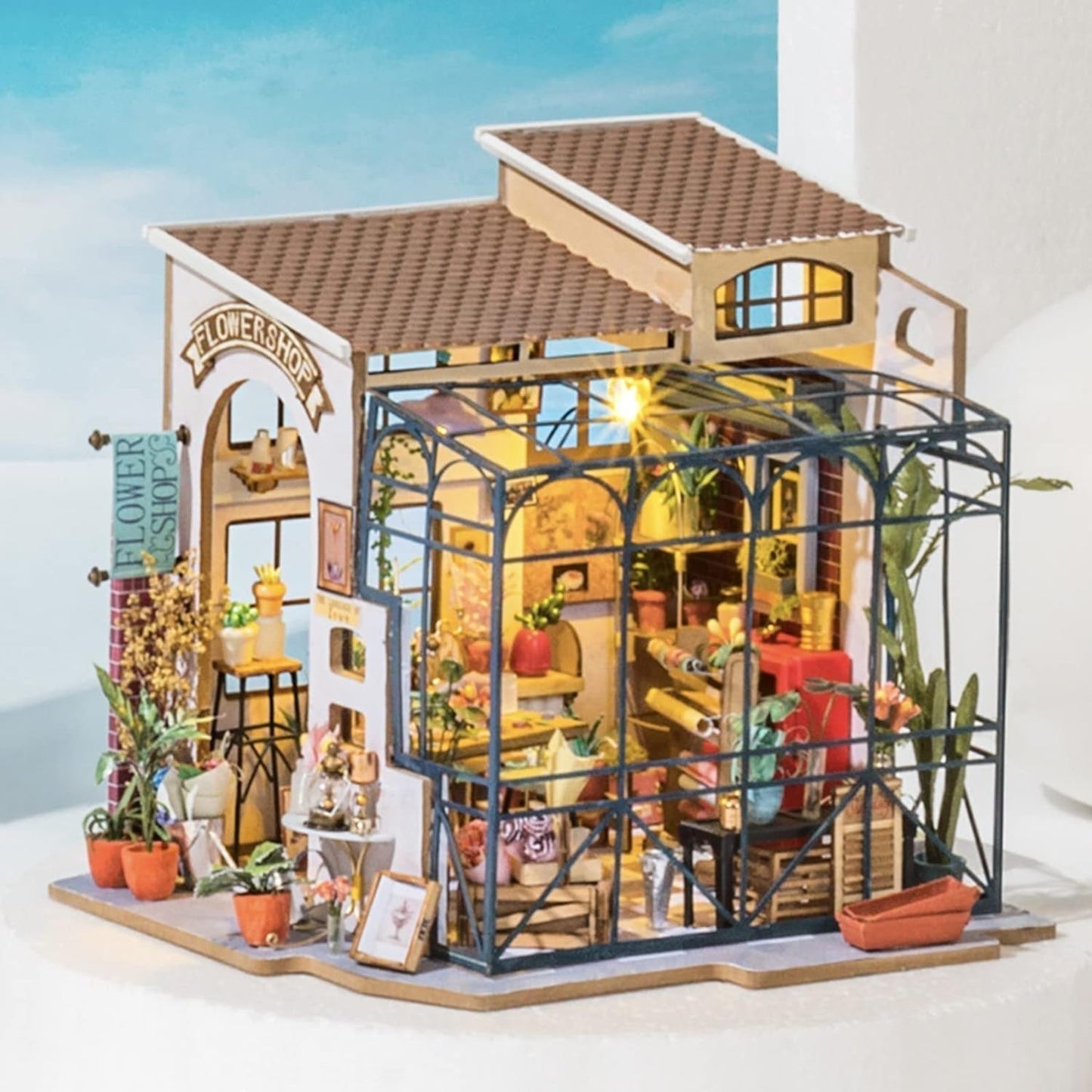 Robotime DG145 Rolife Emily's Flower Shop Casa de Muñecas en Miniatura Fabricada en madera, metal, tela y cartón, Dimensiones: 22 X 15 X 17 Cm, Naty Shop casas de muñecas