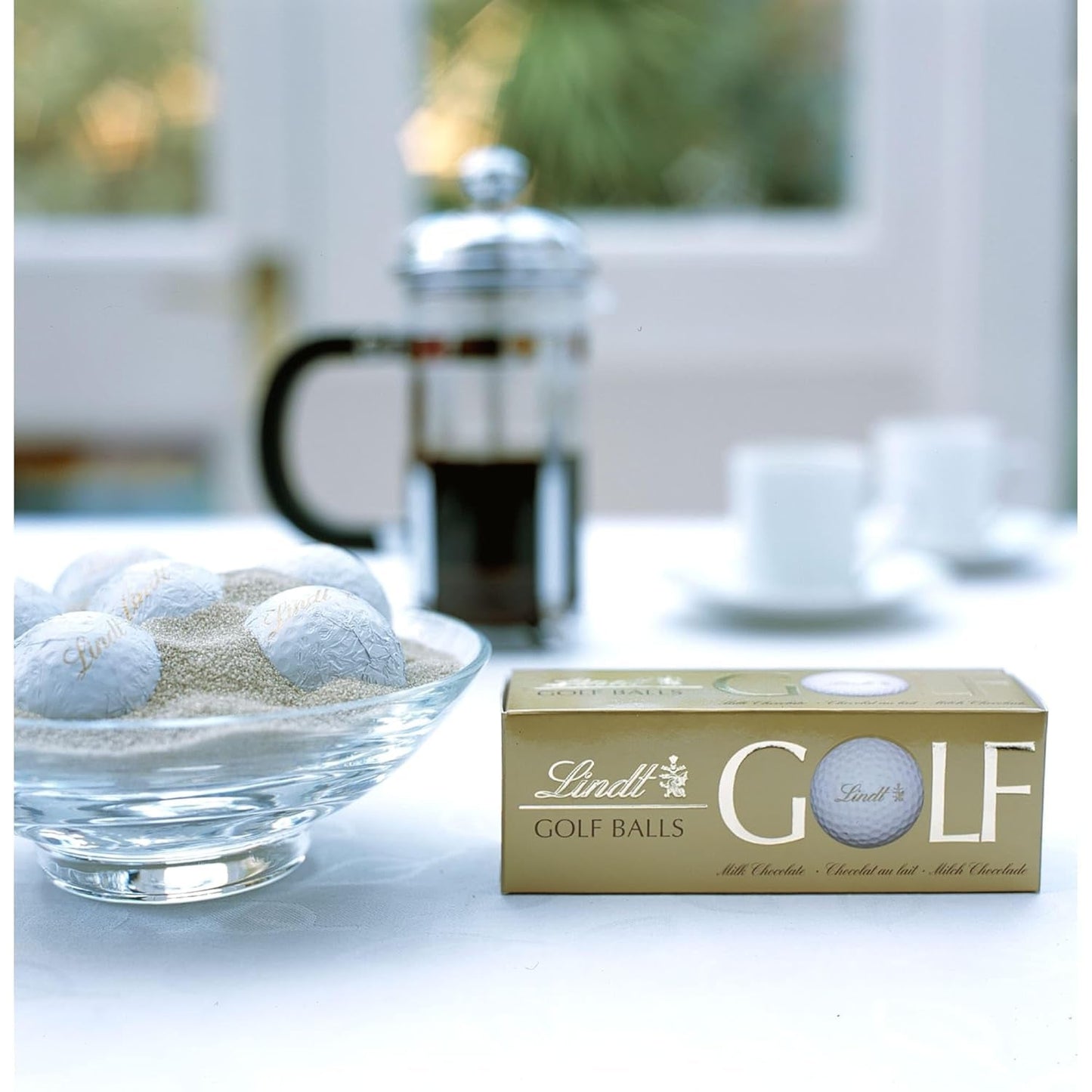 Lindt Schokolade - Pelotas de golf | 110 gramos| Drei Golfbälle Aus Lindt Vollmilch-Schokolade Mit Nougatcremefüllung Und Waffelstückchen | Pralinengeschenk | Regalo para golfista | Tienda Schokoladengeschenk Naty