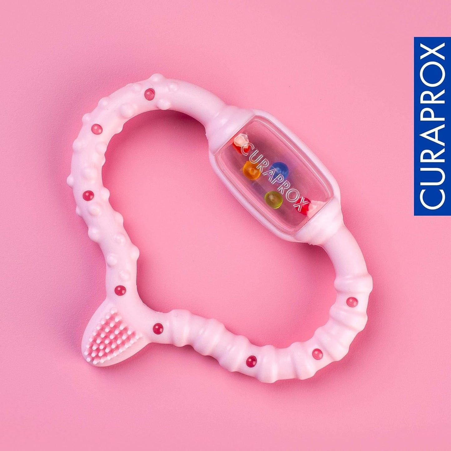 Anillo de dentición Curaprox para bebés - Para niños pequeños 0-24 meses/Alivia el dolor de dientes y promueve las habilidades motoras | Sin BPA, Rosa, con cepillo de dientes de entrenamiento/Fabricado en Suiza