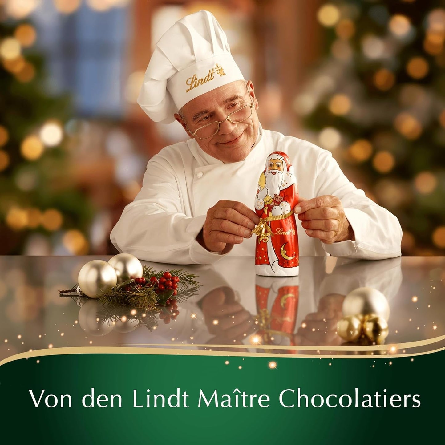 Barra de chocolate con almendras navideñas Lindt | 100 gramos | Almendras en crema de nueces recubiertas del más fino chocolate con leche | regalo de chocolate de navidad