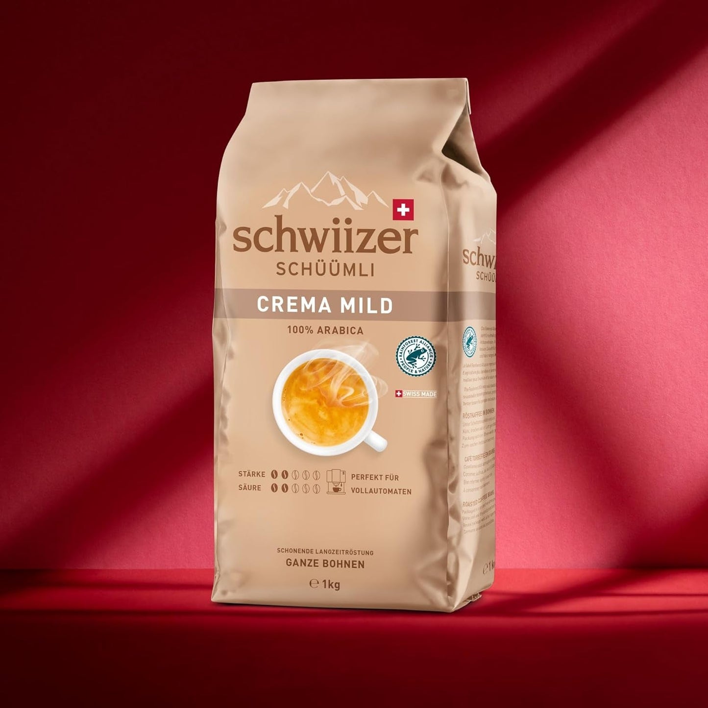 Schwiizer Schüümli Crema Mild, 100% granos de café arábigo premium, afrutado y de nuez, para máquinas de café totalmente automáticas, potencia 2/5, tostado ligero, certificado Rainforest Alliance, 1 kg (paquete de 2)