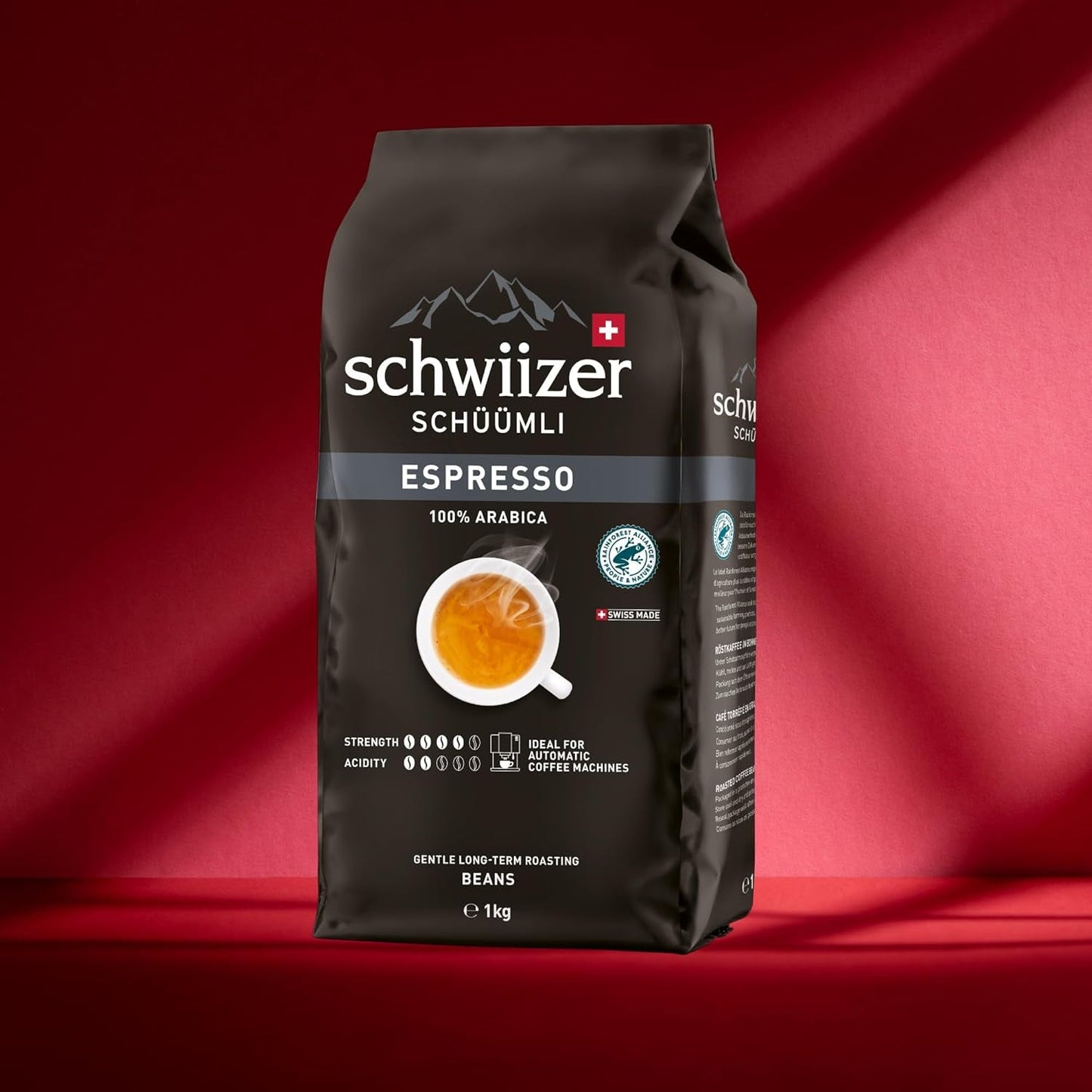 Schwiizer Schüümli Espresso, café en grano 100% Arábica, fuerte e intenso, ideal para cafeteras espresso automáticas, concentración 4/5, tueste medio, Rainforest Alliance, 1kg