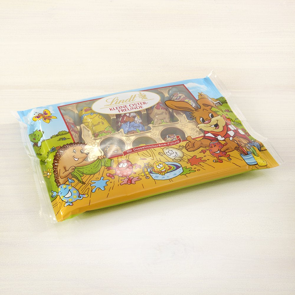Pequeños Amigos de Pascua con Chocolate | 2 x 100 g y Decoración de Chocolate Mini Huevos con Leche Alpina | 2 sobres de 180 g | Huevos de chocolate con leche premium, empaquetados de forma alegre y colorida, en cuatro colores para Pascua