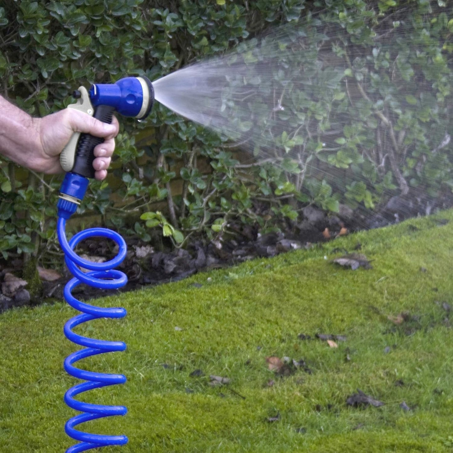 Juego de manguera en espiral TATAY de 10 m con accesorios de plástico con protección UV, ideal para terrazas y pequeños jardines.