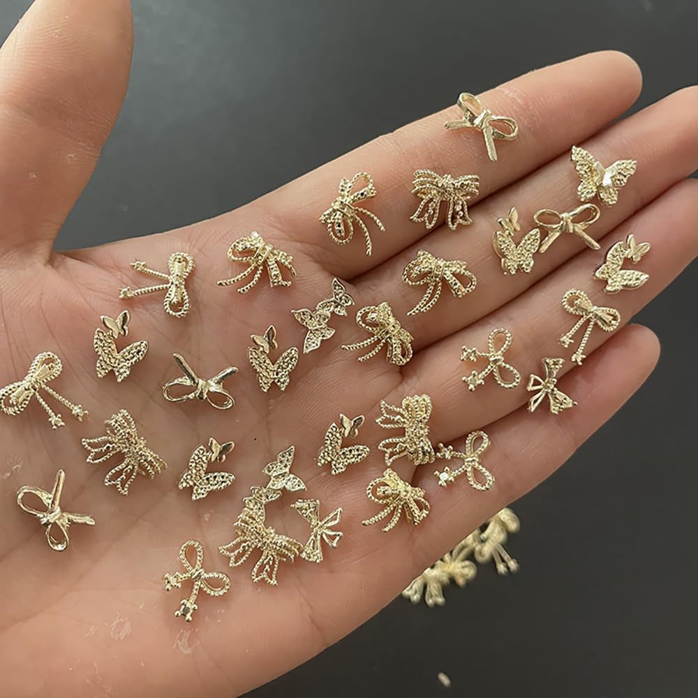 50Stück 3D Lazo Dorado Nail Charms Mariposa Nail Art Charms Legierung Bogen Nagel Charms Nägel Zubehör Schleife Nagelschmuck Metall Schleifen Schmetterling Nageldesign Nagelanhänger Nailart Strasssteine