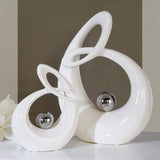 GILDE Escultura decorativa de cerámica La Vida - figura blanca/plateada vidriada blanca con bola plateada - altura 22 cm Estatuillas y esculturas Naty Shop