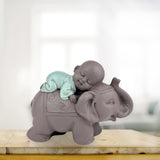 Zen'Light Estatua Bonzo de Buda durmiendo sobre un elefante - Atmósfera zen en tu espacio sagrado - Hermosa figura auspiciosa -Al. 9,5 cm, marrón y verde Estatuillas y esculturas Naty Shop